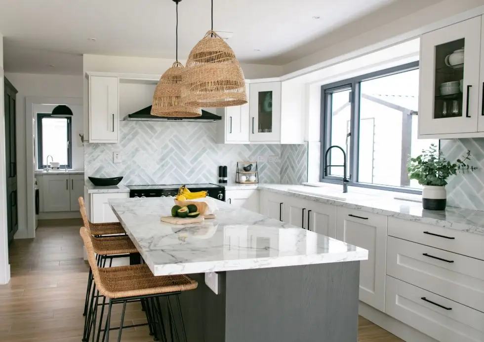 Modern island kitchen with granite countertop, breakfast counter, and premium modular cabinets in Banjara Hills Hyderabad